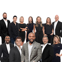 a group of business people posing for a photo